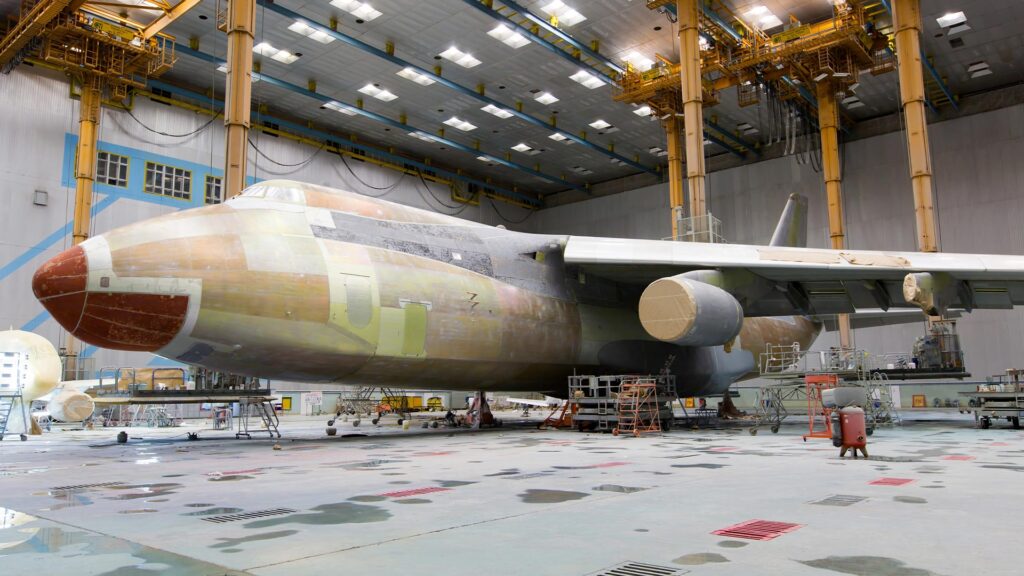 Modern business aircraft in the hangar during the heavy maintenance and modification for special mission purposes